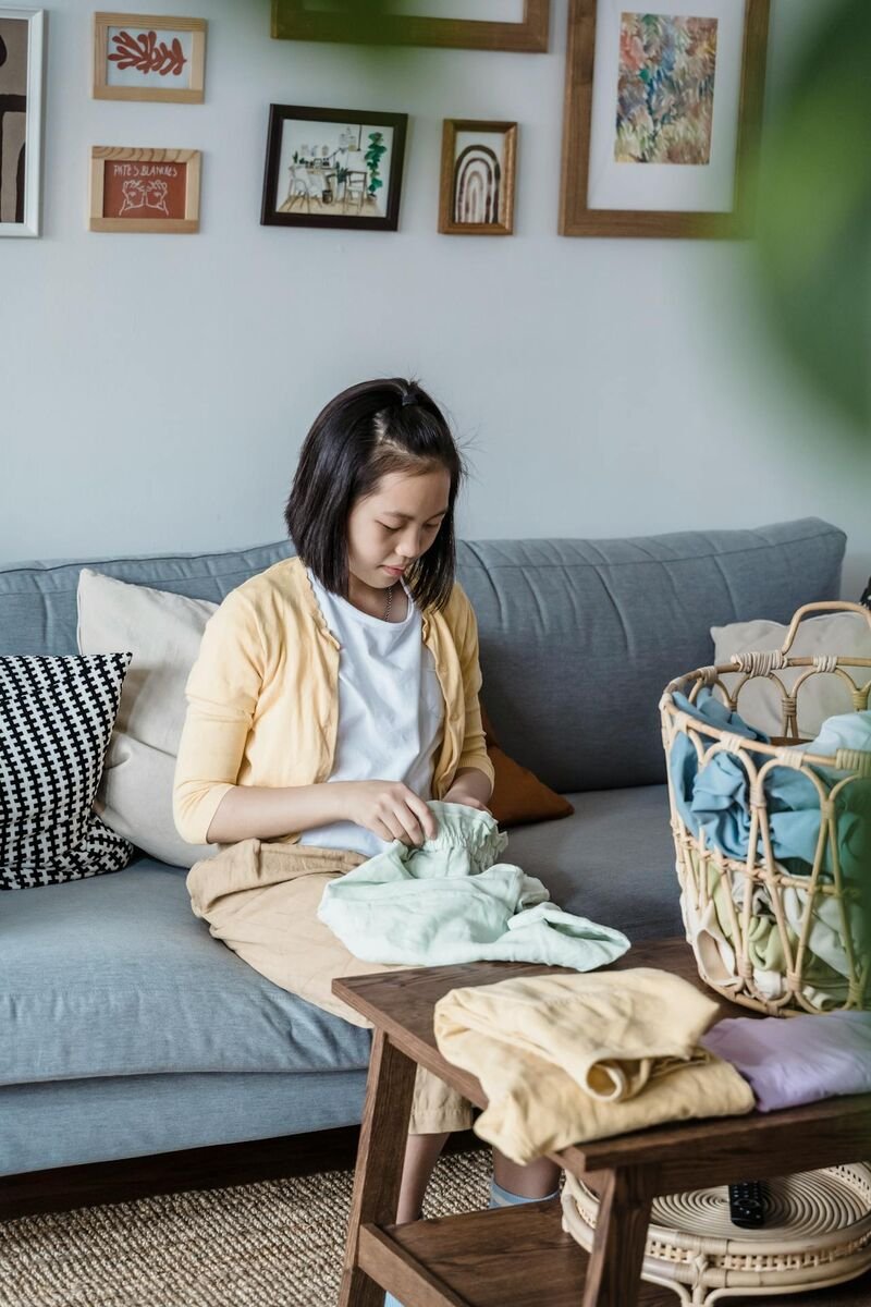 girl-folding-clothes