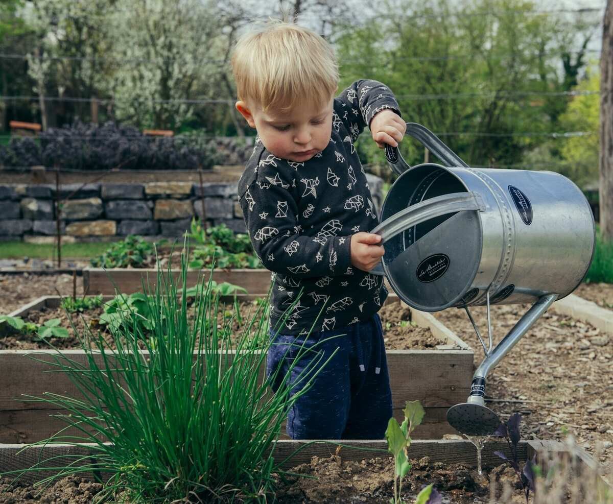 kid-watering-plants