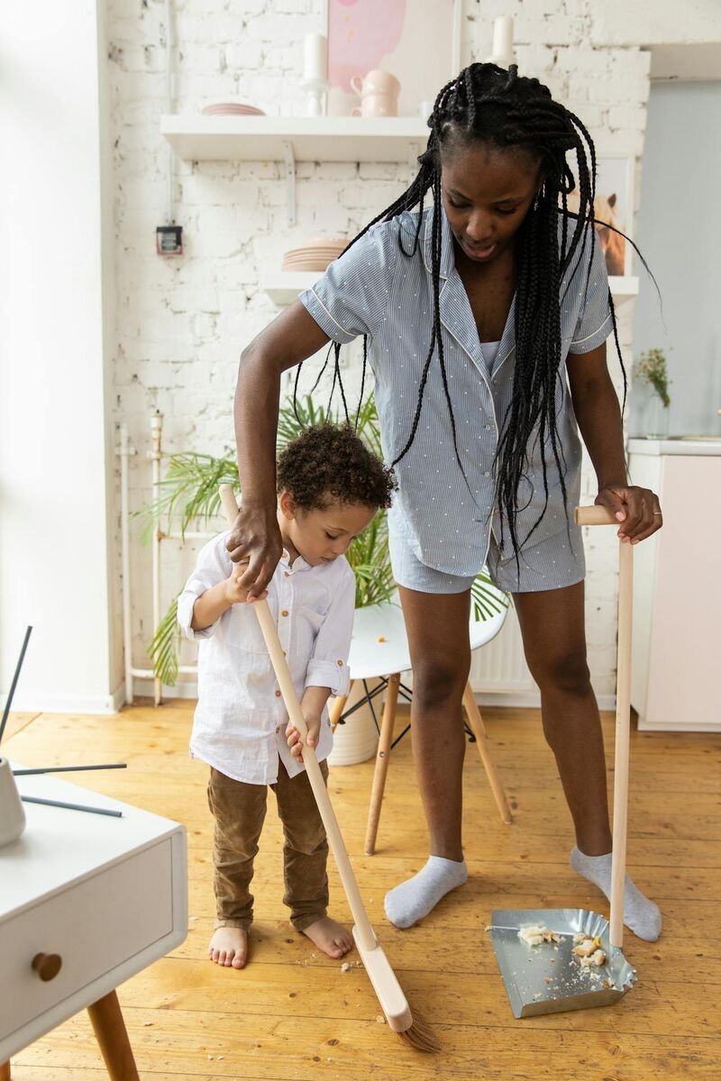 woman-teaching-a-kid-to-clean-the-floor